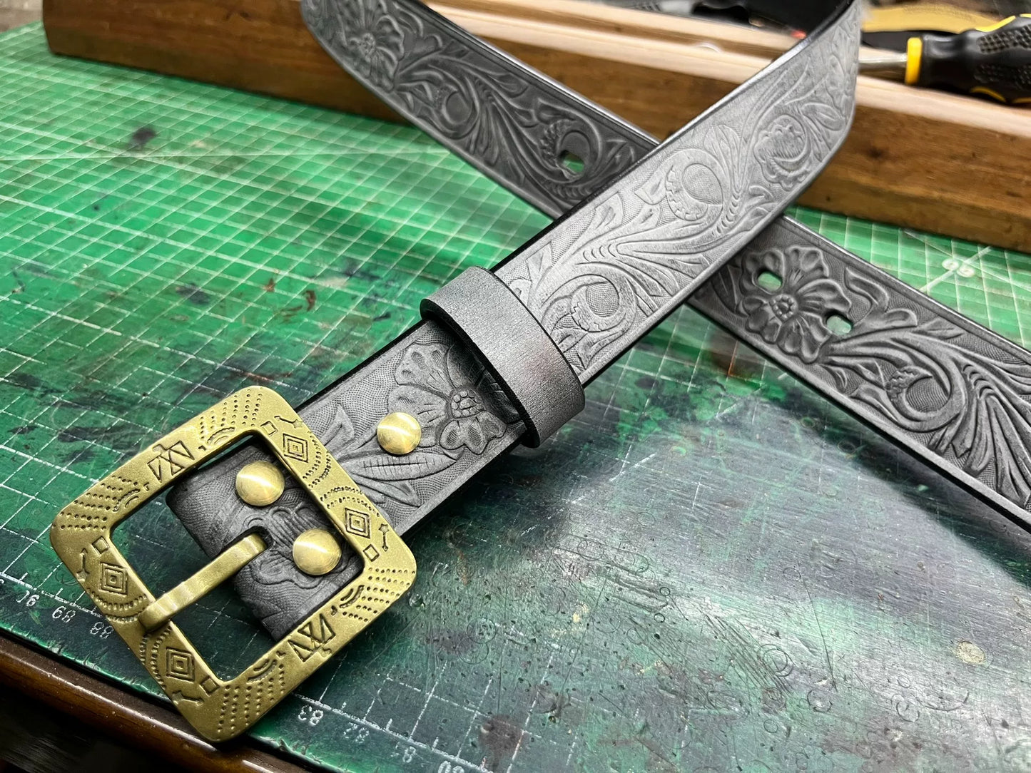 The machine-carved handmade belt of Italian horse-bridle leather is…