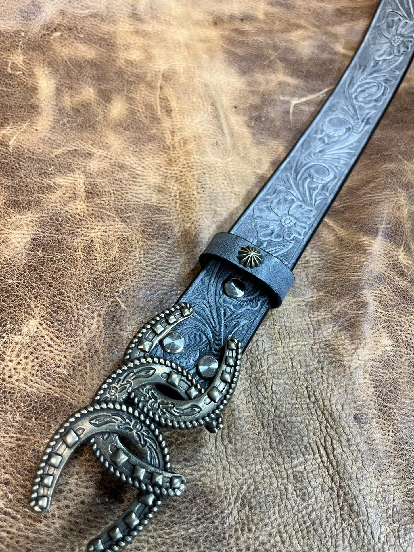 So handsome. Black imported full-grain Italian horse-rein carved ge…