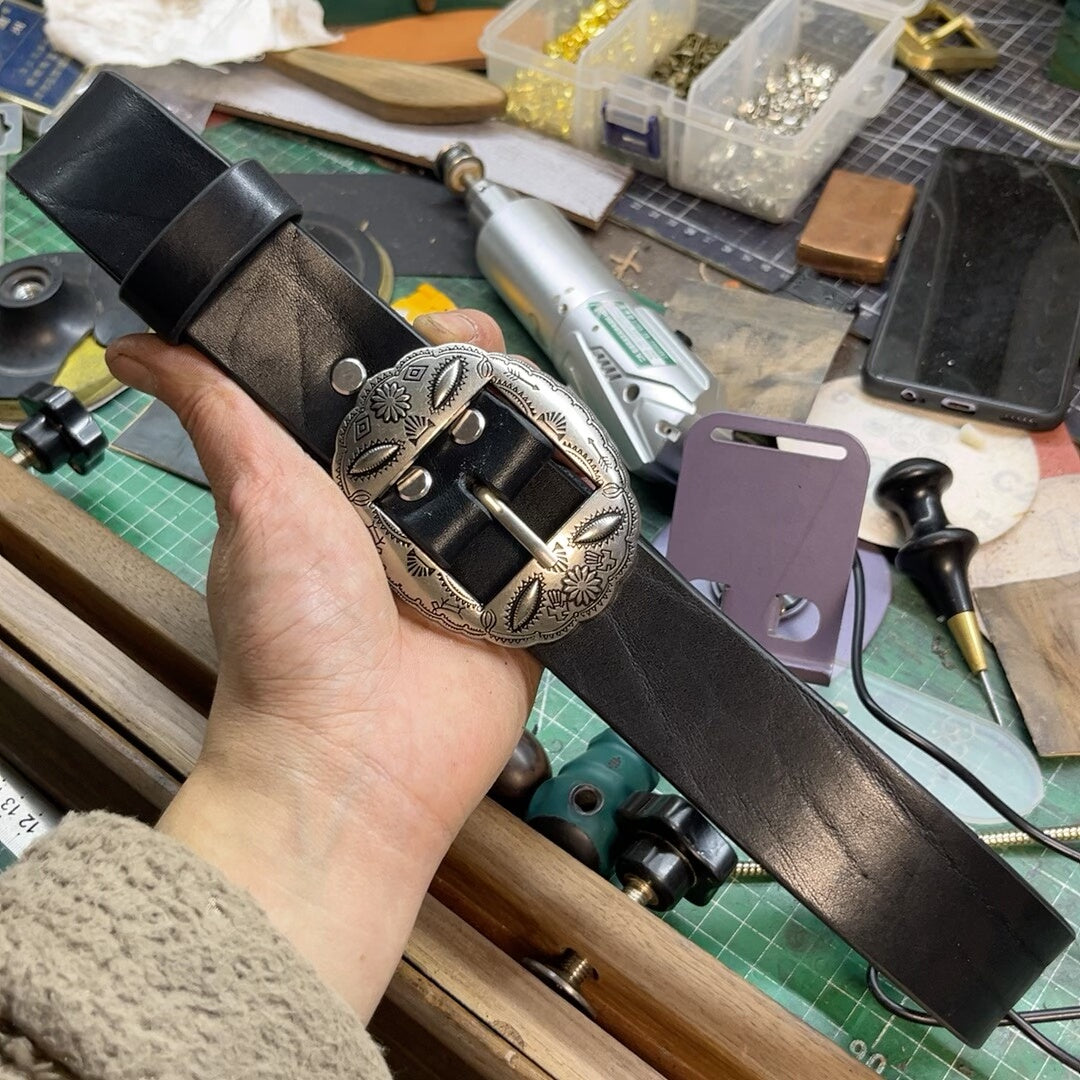 A dozen slightly blemished bison leather belts