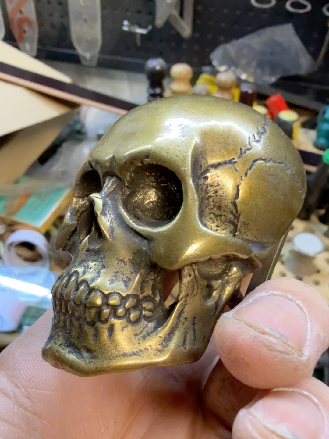 There is only one brass skull belt buckle