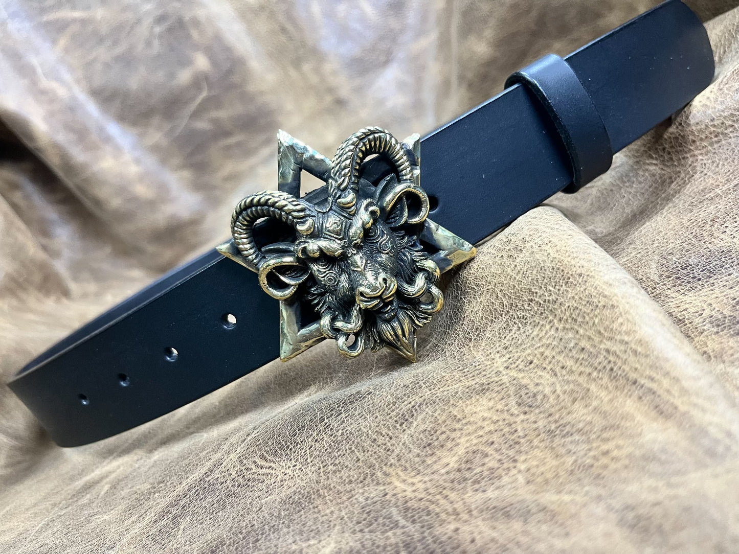 The three-dimensional Pan God smooth buckle is paired with a custom…