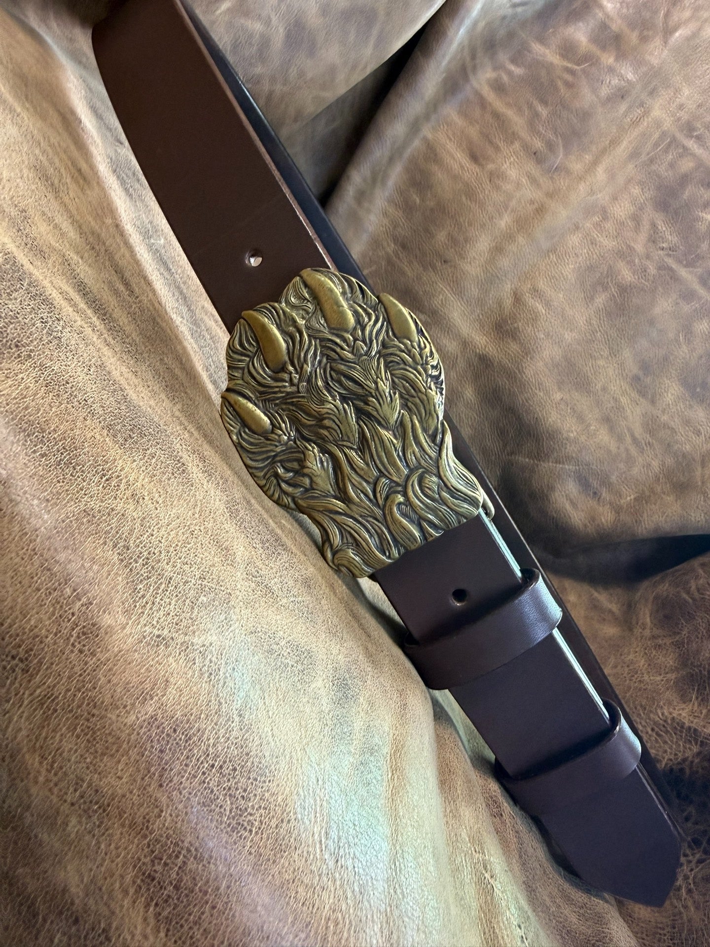 Brass embossed bear claw belt buckle with brown saddle