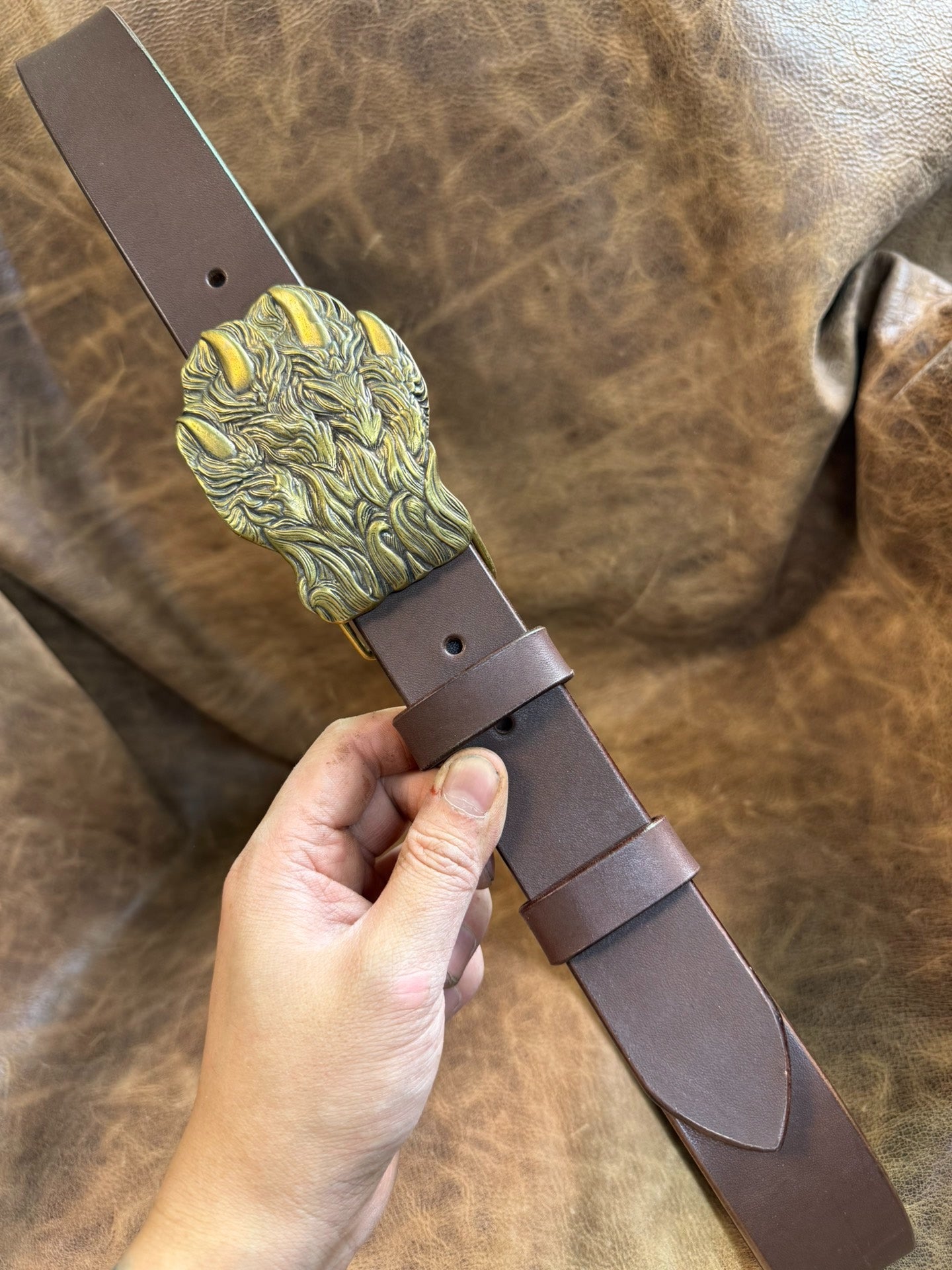 Brass embossed bear claw belt buckle with brown saddle