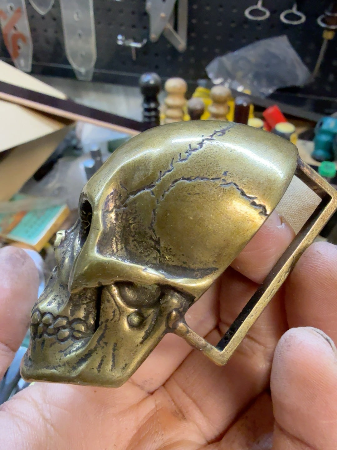 There is only one brass skull belt buckle