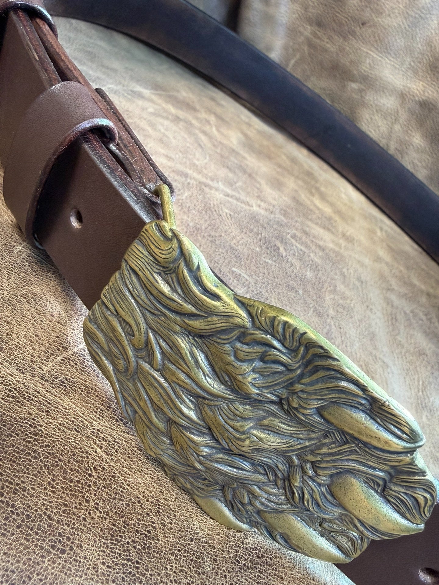 Brass embossed bear claw belt buckle with brown saddle