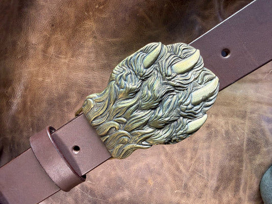 Brass embossed bear claw belt buckle with brown saddle