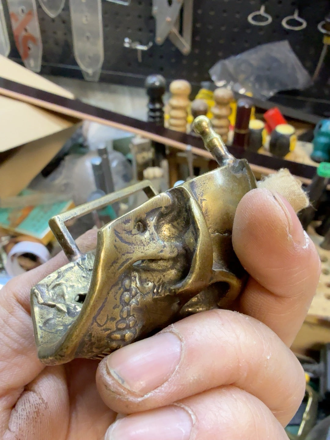 There is only one brass skull belt buckle
