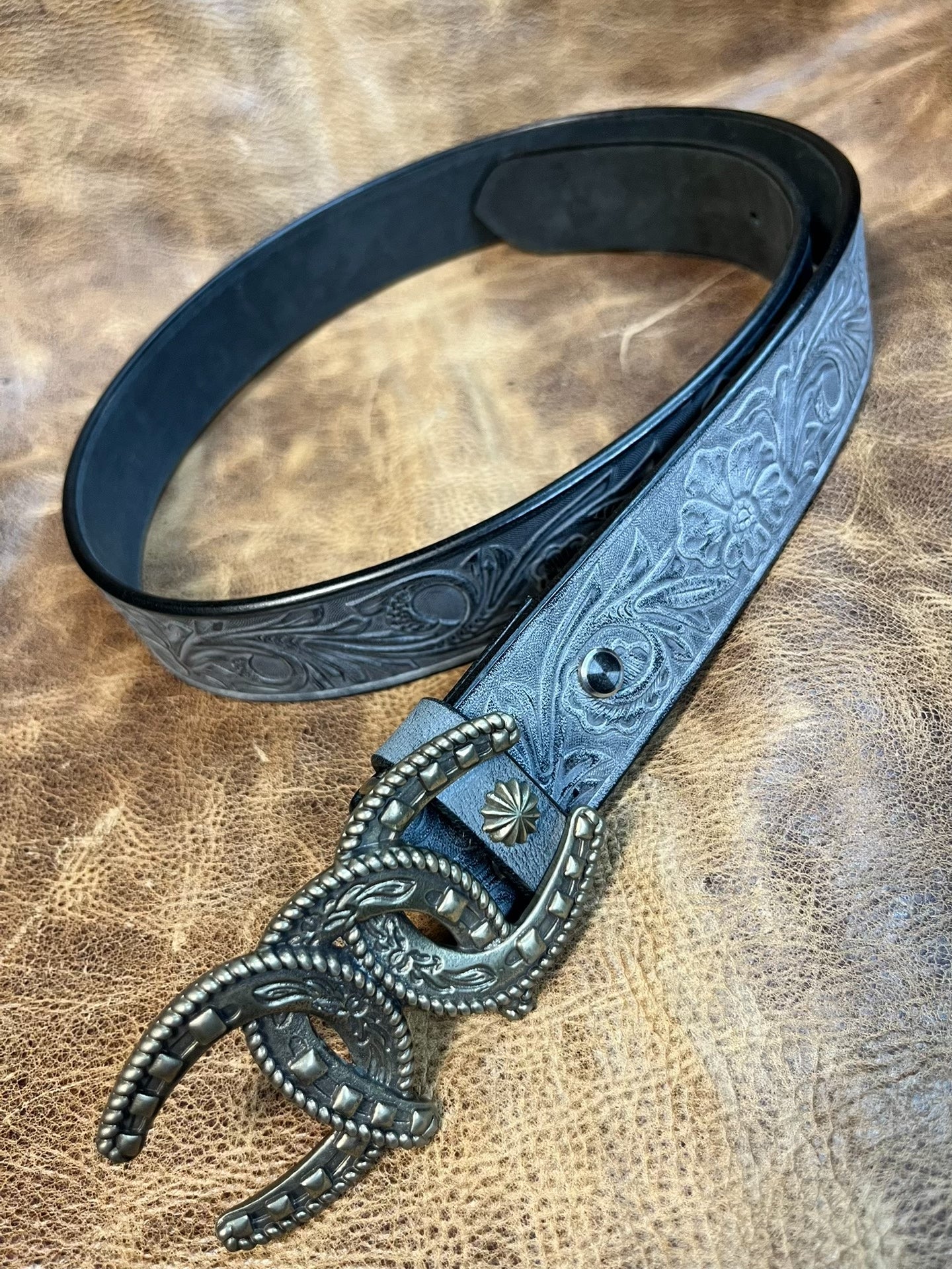 So handsome. Black imported full-grain Italian horse-rein carved ge…