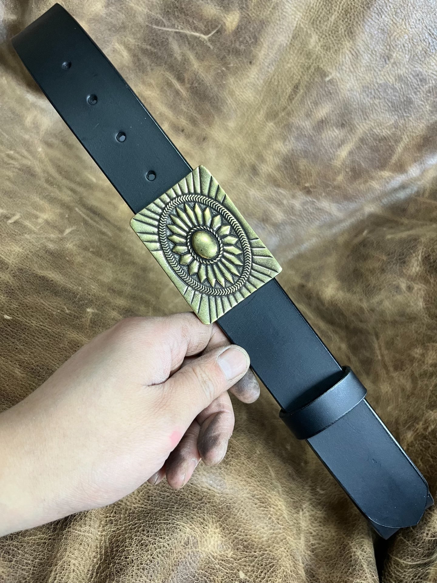 The three-dimensional brass Navajo smooth gusset buckle is paired w…