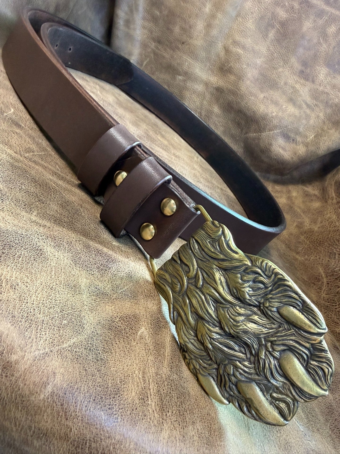 Brass embossed bear claw belt buckle with brown saddle
