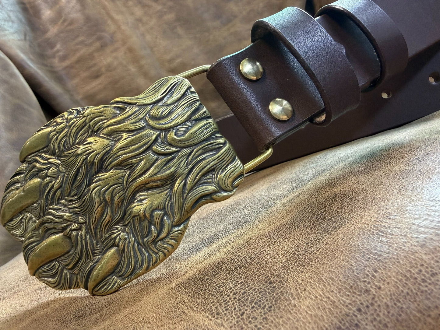 Brass embossed bear claw belt buckle with brown saddle