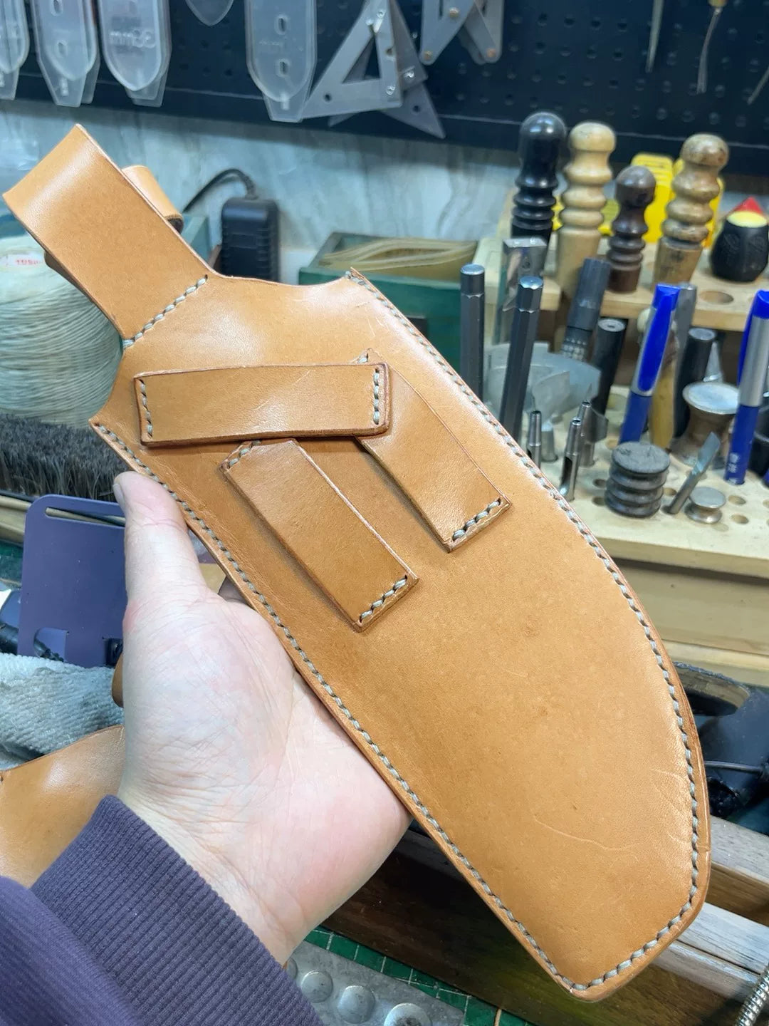 The cowhide scabbard is custom-made and handmade. The customer need…