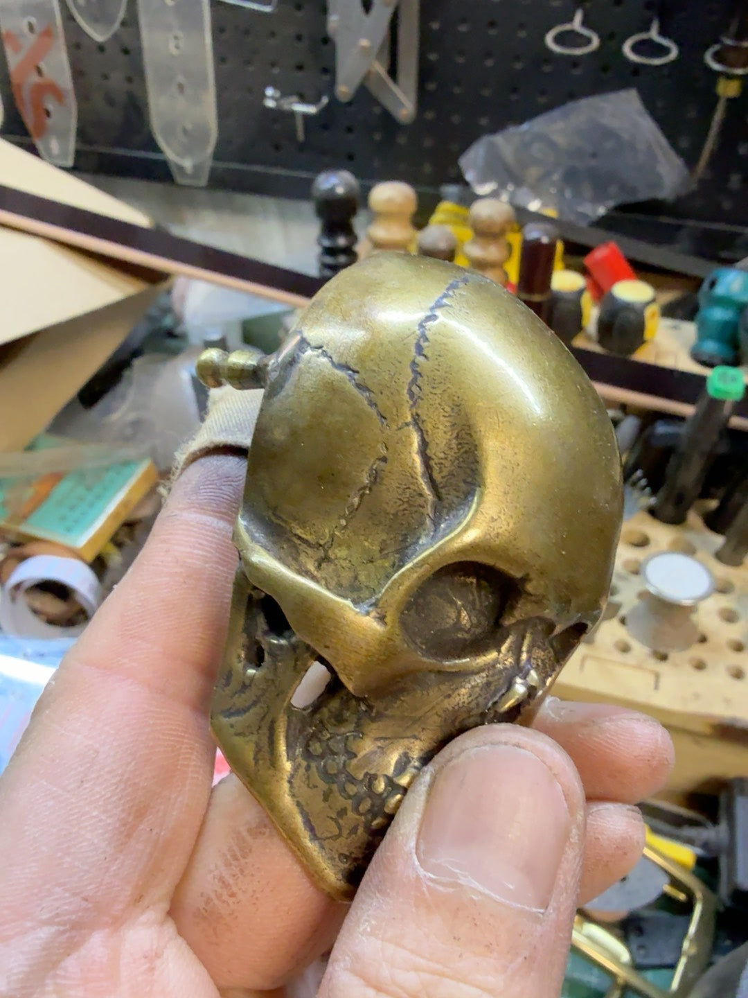 There is only one brass skull belt buckle