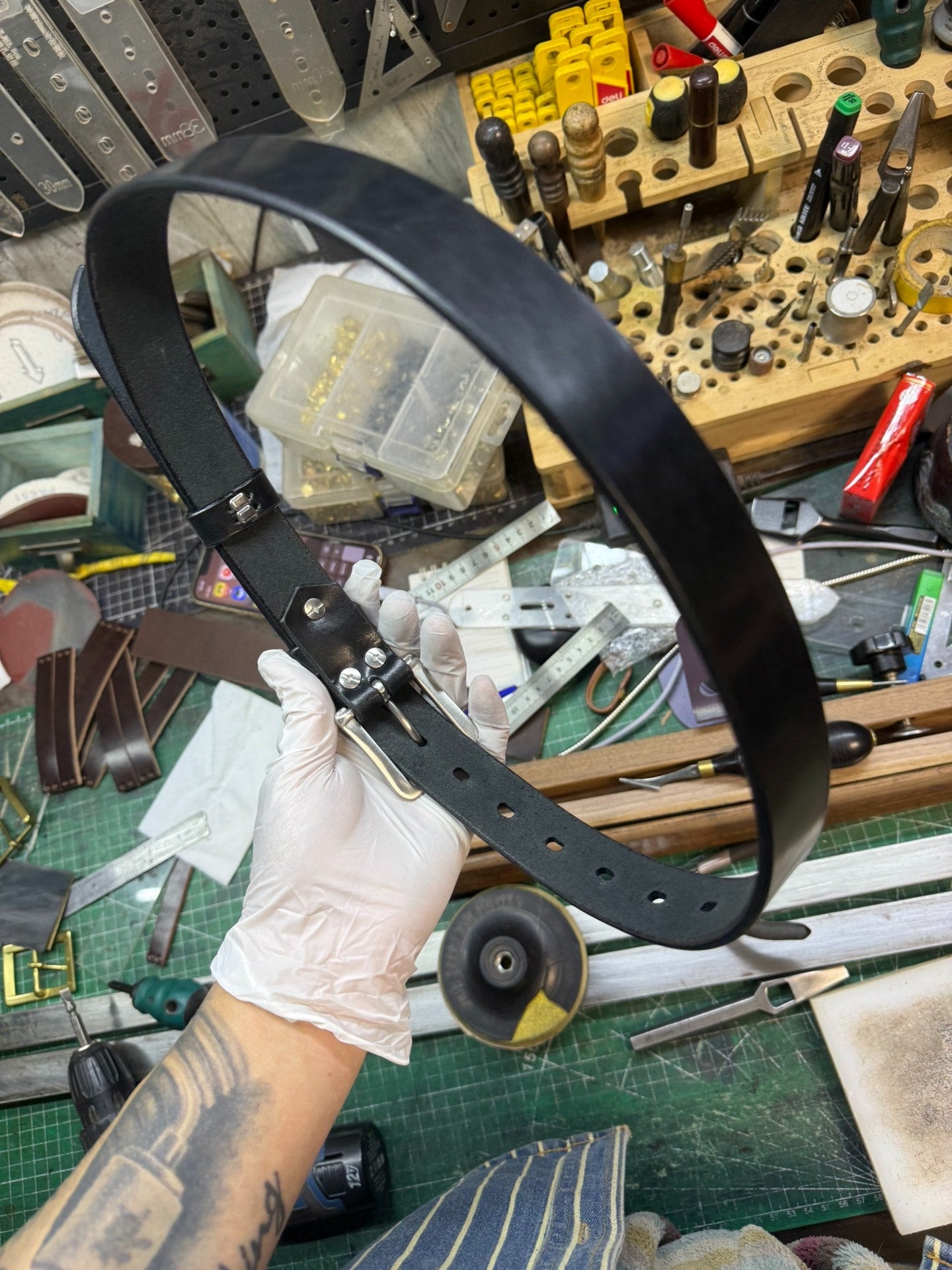 More than a dozen pieces of women's oil-waxed leather belts with sl…