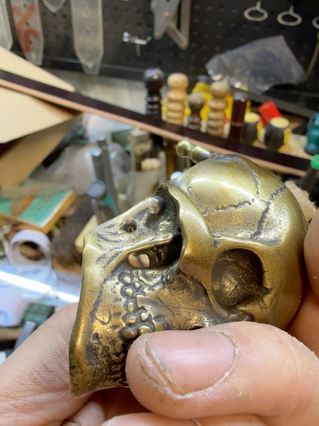 There is only one brass skull belt buckle